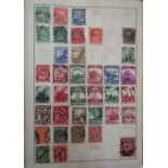 Three albums containing a collection of British and Worldwide stamps dating from the early 20th