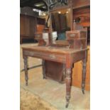 An Edwardian walnut dressing table together with a timber lathe and steel banded dome top trunk, a