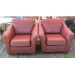 A pair of vintage style club armchairs, in a mid brown leather finish by Marks and Spencer, raised