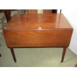 A 19th century mahogany Pembroke table with frieze drawer raised on square tapered legs with brass