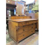An unusual Victorian mahogany dressing chest with arched swing mirror over an arrangement of eight