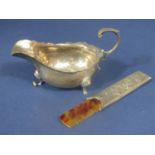 Edwardian silver cream jug with shaped rim and cabriole hoof feet (af) together with a further