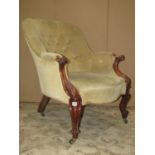 A Victorian spoon and button back drawing room chair, with partial rosewood show wood frame,
