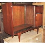 A Younger Afrimosia low side cabinet, freestanding, partially enclosed by a pair of sliding glass