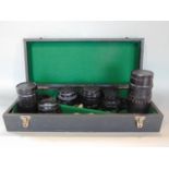 A baize lined case containing six various lenses to include Pentacon 4/200 lens, further Helios-44-2