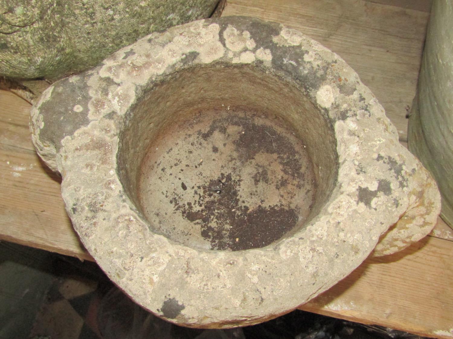 An old, possibly ancient, carved stone mortar with lug handles, 28 cm in diameter (excluding - Image 2 of 2