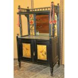 A Victorian aesthetic movement side cabinet with ebonised finish, the lower section enclosed by a