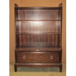 A Stag Minstral dwarf floorstanding open bookcase with two adjustable shelves over a long drawer and