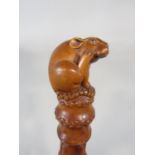 A good carved Japanese simulated bamboo fruit wood walking stick, mounted by a carved rat knop and