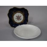A late 18th century Worcester blue ground dish of square shaped form with painted floral bouquet