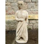 A carved stone statue "fashion" in the form of a lady in standing pose, with wavy plaited hair and