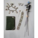 Mixed lot to include a yellow metal stick pin set with a seed pearl, an Edwardian silver hat pin