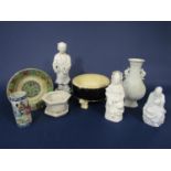 A collection of oriental ceramics including three Blanc De Chine figures male and female of