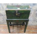 An antique painted coffer on stand with domed lid, raised on a simple open framework, with square