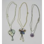 Three enamelled silver pendant necklaces comprising a butterfly example with twin baroque pearl