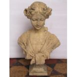 A buff coloured composition stone head and shoulder bust of an Art Nouveau style maiden, 47 cm high