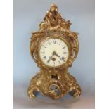 Rococo style gilt cast metal single train mantle clock, painted with Roman numerals, quartz