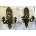 A pair of carved gilt wood two branch wall scones with scrolling acanthus detail, 45 cm high