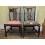 A pair of Georgian mahogany dining chairs with pierced splats, over drop-in upholstered pad seats,