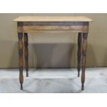 A 19th century fruitwood side table with segmented frieze drawer raised on ring turned and tapered