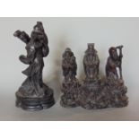 A resin character group of three mortals on a naturalistic carved based, together with a further