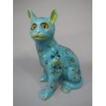 An early 20th century cat in the Galle manner with turquoise glaze and painted floral decoration