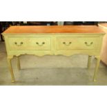 A Georgian style oak dresser fitted with two frieze drawers over a shaped apron, supports and pad