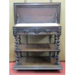 A mid Victorian period oak three tier buffet of rectangular form, with barley twist supports,