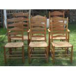 A mid 19th century good quality set of six (4+2) ash-wood ladder-back dining chairs, with rush seats