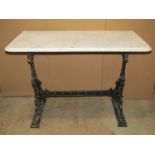 A cast iron pub table of rectangular form with decorative detail and raised lettering, Gaskell and
