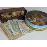 Two tins of mixed British and foreign coins and bank notes