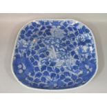 A large 19th century oriental dish of square shaped form, possibly Japanese for the Chinese