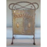 Good Arts & Crafts embossed copper firescreen in a riveted iron frame, the copper embossed with a