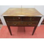 A Georgian mahogany side table fitted with one long and two short drawers, on square cut supports,