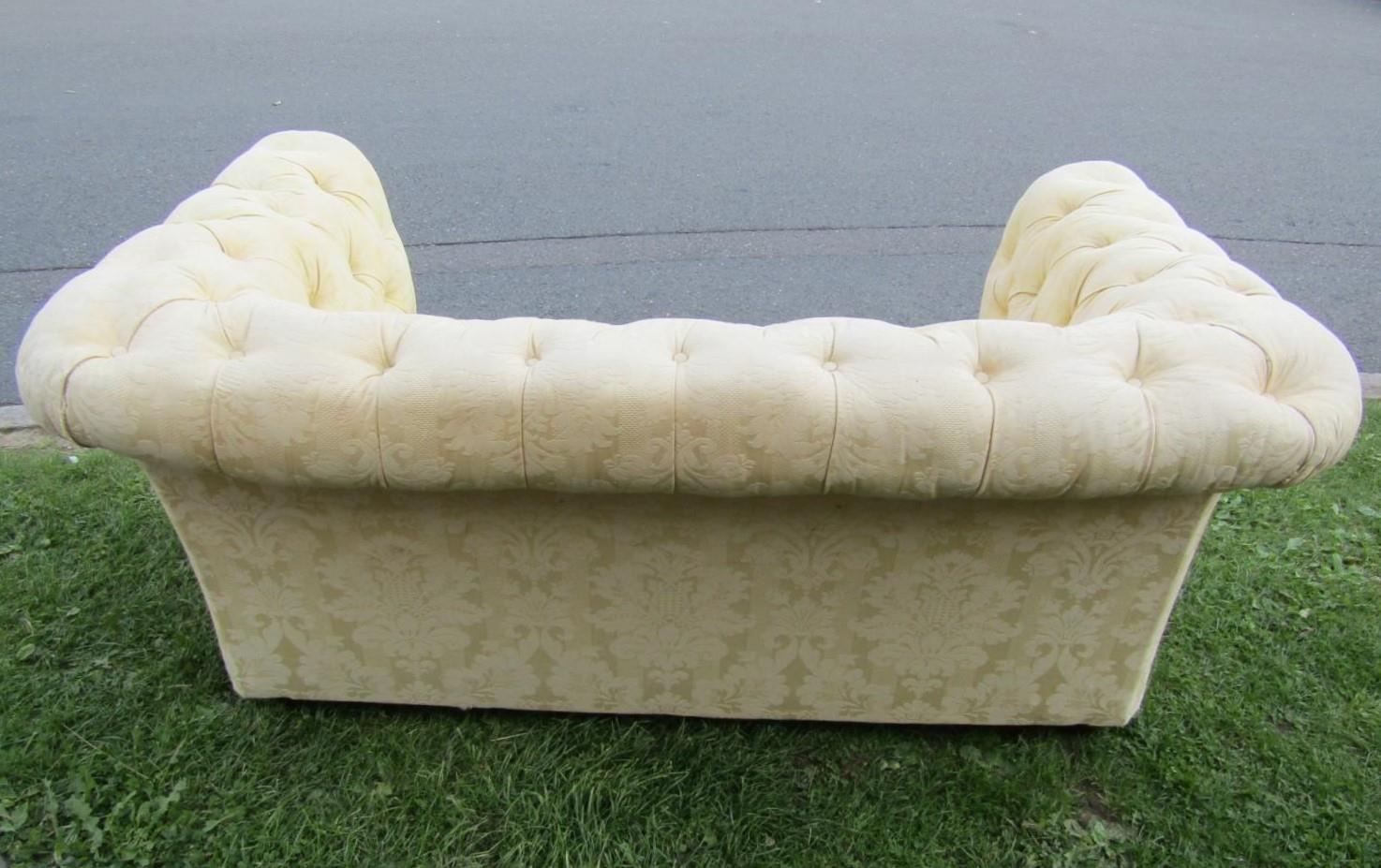 A two seat Chesterfield sofa with repeating floral pattern upholstery buttoned back and rolled arms, - Image 3 of 4