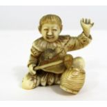 Taisho Period - Ivory Okimono of a crouching boy with barrel and fan, surprised by a rat, signed,