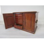 A good 19th century mahogany collectors/specimen cabinet, the twin doors enclosing twelve short