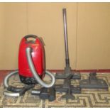 A Miele cat and dog 700 electric vacuum cleaner and attachments
