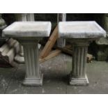 A two sectional contemporary cast composition stone bird bath with square top and further square