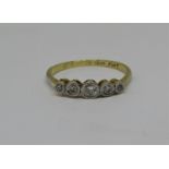 18ct graduated five stone diamond ring, centre stone 0.15cts approx, size S, 2.3g