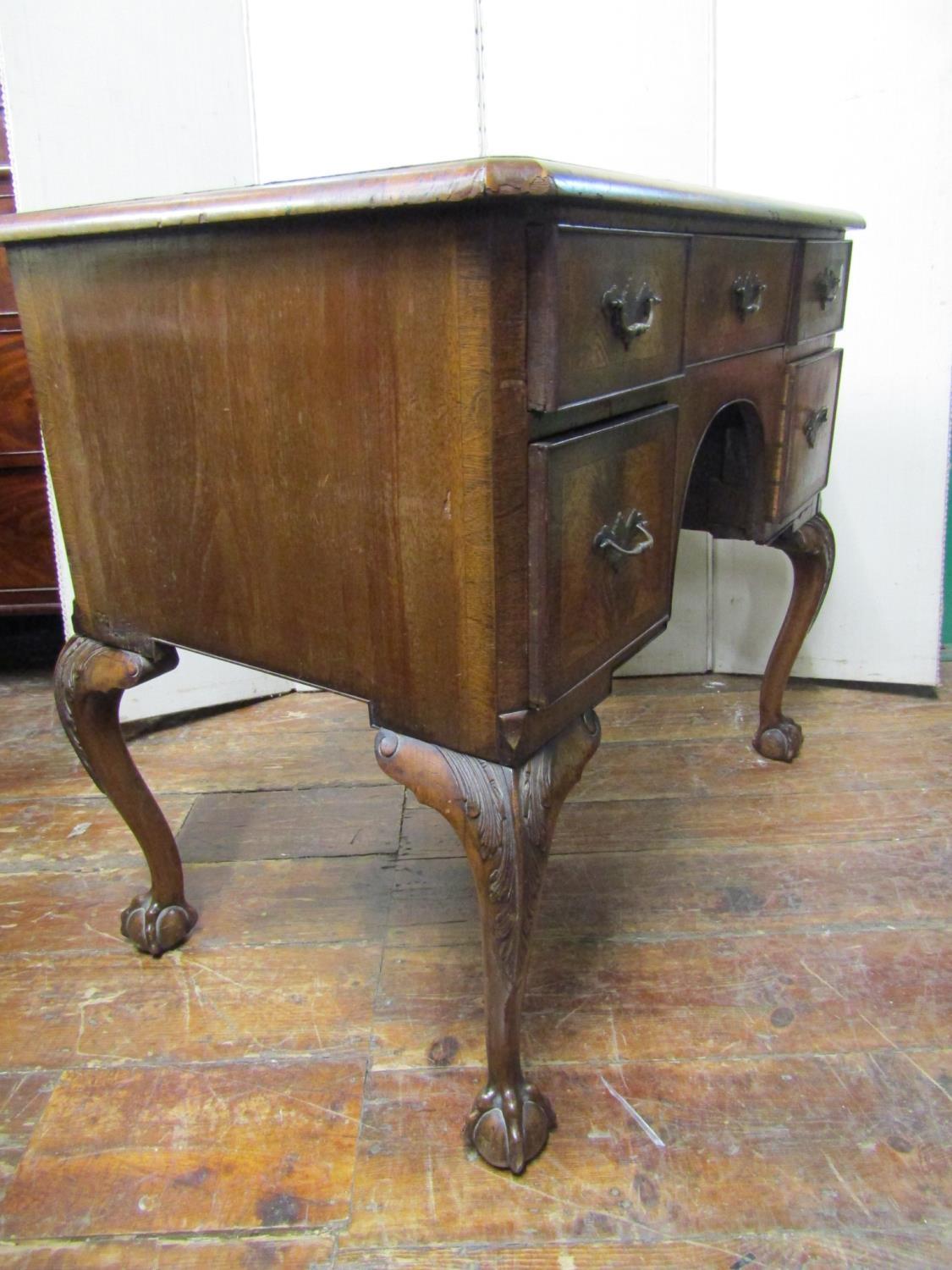 A walnut knee hole writing table in the Georgian manner, five frieze drawers around a central - Image 3 of 3