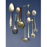 A collection of Scandinavian spoons to include David Andersen example, enamelled examples and others