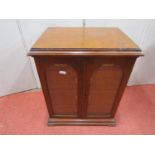 A good Victorian oak collectors cabinet enclosed by a pair of plate glass doors enclosing three long