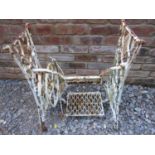 A vintage but later painted Singer cast iron sewing machine base together with one other with