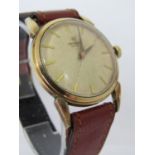 Vintage gent's universal gold plated dress watch, with convex gilt dial and gilt baton markers