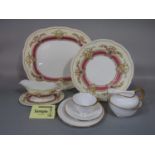 A collection of Cauldon China dinnerwares comprising a pair of oval meat plates, sauce boat and