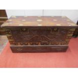 A carved eastern hardwood coffer, the front elevation with geometric floral detail, over three