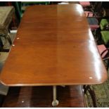 A late regency period mahogany twin pedestal extending dining table, with single additional leaf,