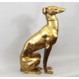 A brass figure of a seated whippet, 56 cm in height