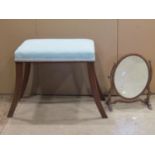 A small Georgian style toilet mirror of oval form with skeleton frame together with a rectangular